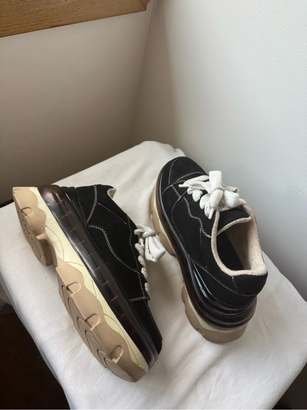 Steve Madden Evolved Sneaker in black with a chunky cream and tan platforms 9.5